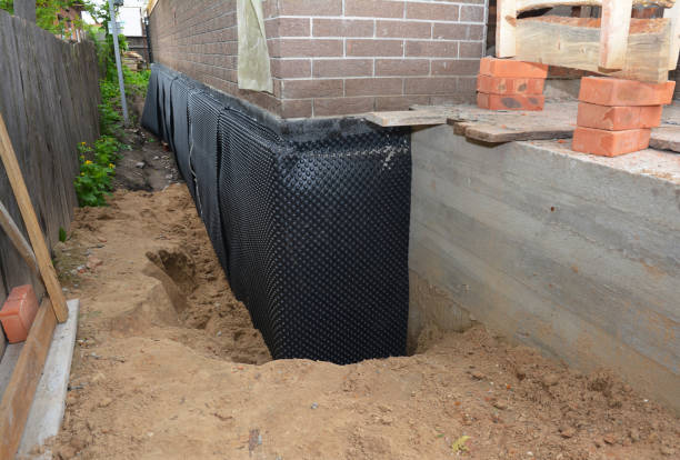 Happy homeowners after waterproofing job in Maxwell